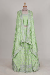 Powder green satin lehenga featuring delicate embroidery with a bordered design paired with a matching self shawl