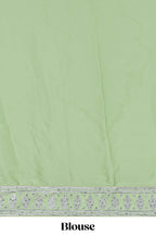 Powder green satin lehenga featuring delicate embroidery with a bordered design paired with a matching self shawl