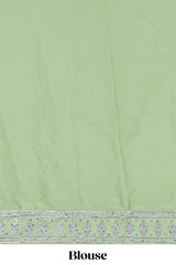 Powder green satin lehenga featuring delicate embroidery with a bordered design paired with a matching self shawl