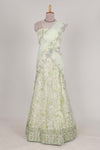 powder green net lehenga featuring delicate embroidery with a borderless design paired with a matching self shawl