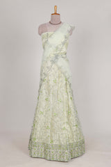 powder green net lehenga featuring delicate embroidery with a borderless design paired with a matching self shawl