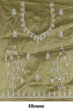 Olive Green net lehenga featuring delicate embroidery with a borderless design paired with a matching self shawl