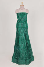 Bottle Green net lehenga featuring delicate embroidery with a borderless design paired with a matching self shawl