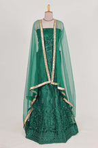 Bottle Green net lehenga featuring delicate embroidery with a borderless design paired with a matching self shawl