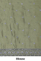 green satin lehenga featuring delicate embroidery with a bordered design paired with contrast shawl