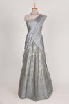 Silver satin lehenga featuring delicate embroidery with a bordered design paired with contrast shawl