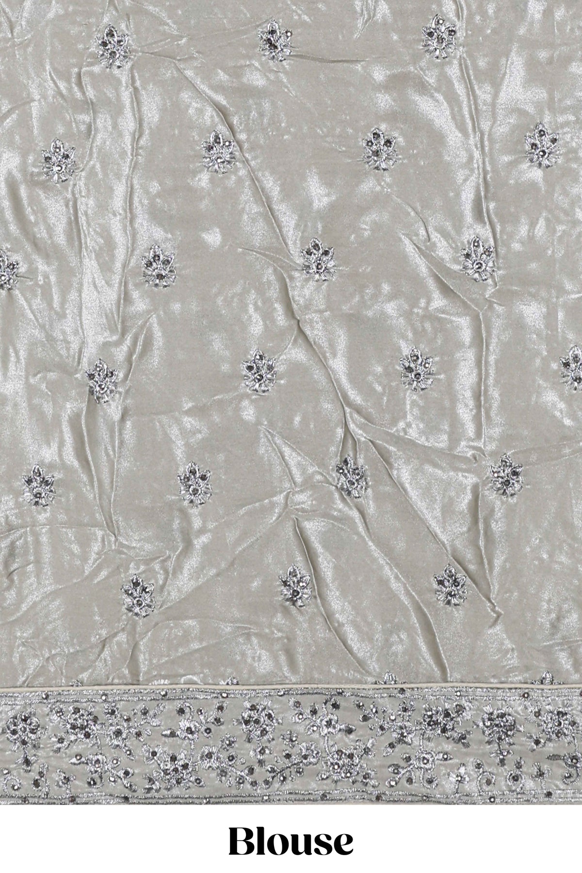 Silver satin lehenga featuring delicate embroidery with a bordered design paired with contrast shawl