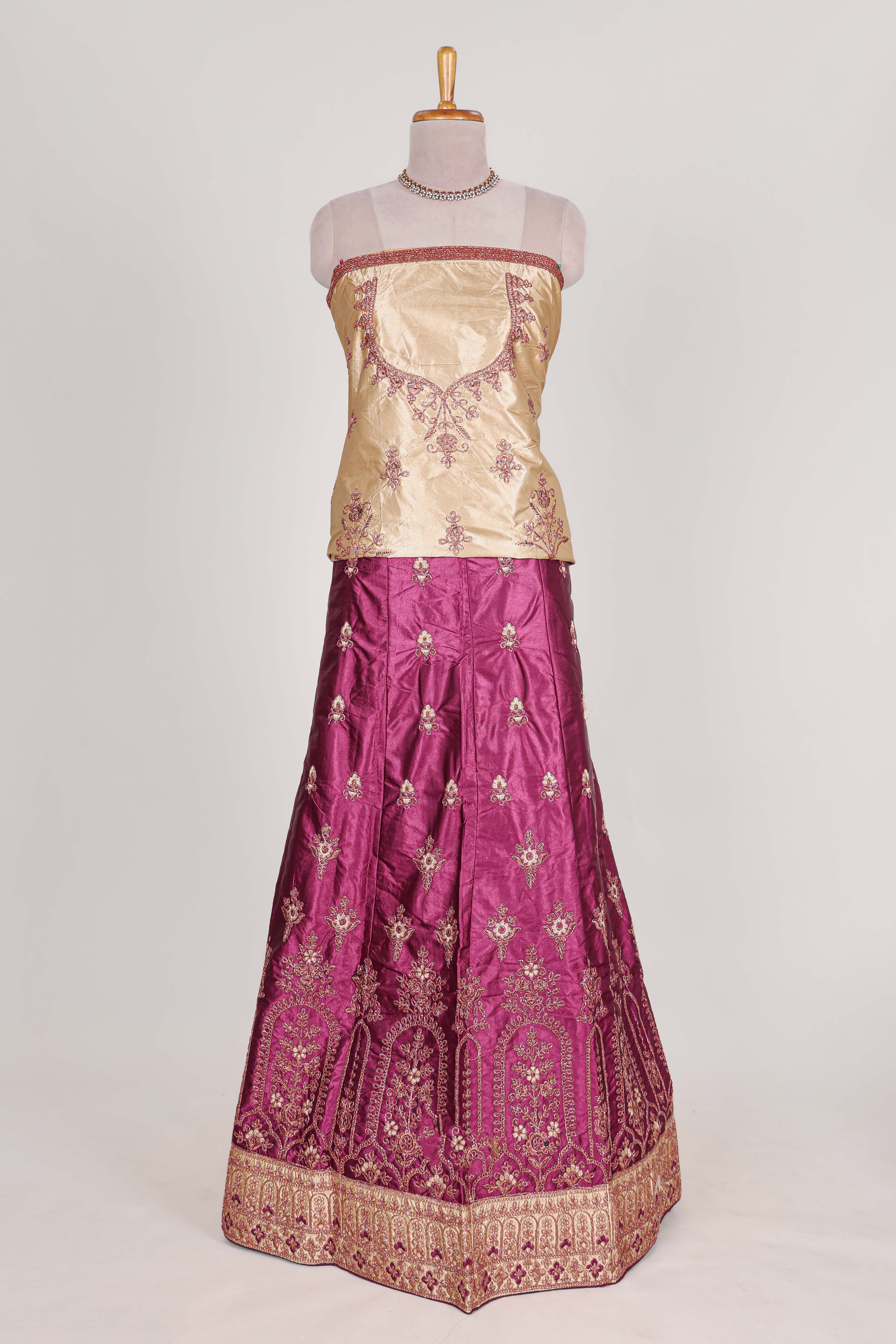 Beautiful satinlehenga adorned with intricate embroidery Paired with a contrast chiffon shawl