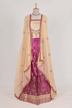 Beautiful satin  lehenga adorned with intricate embroidery Paired with a contrast chiffon shawl