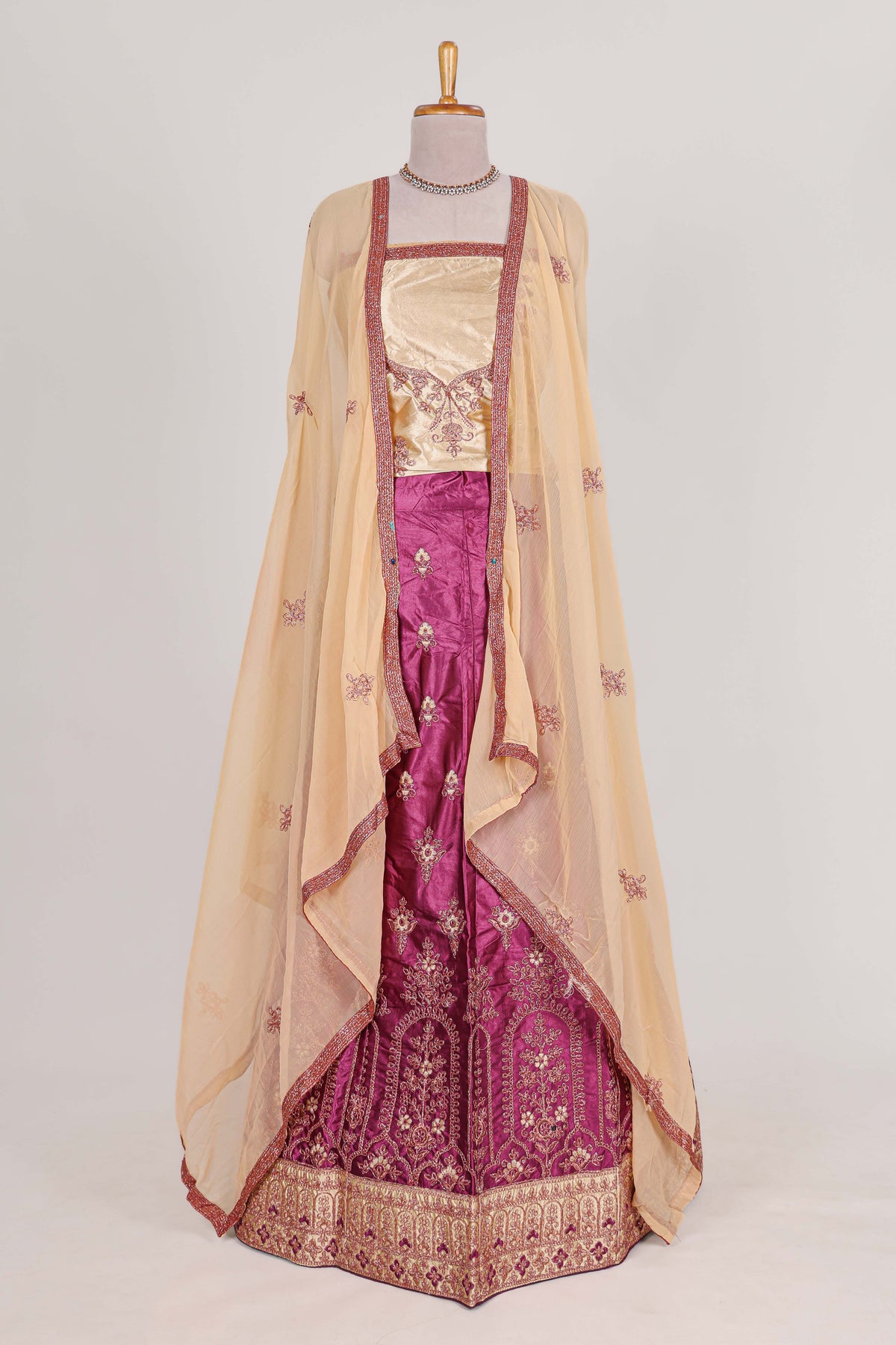 Beautiful satin  lehenga adorned with intricate embroidery Paired with a contrast chiffon shawl