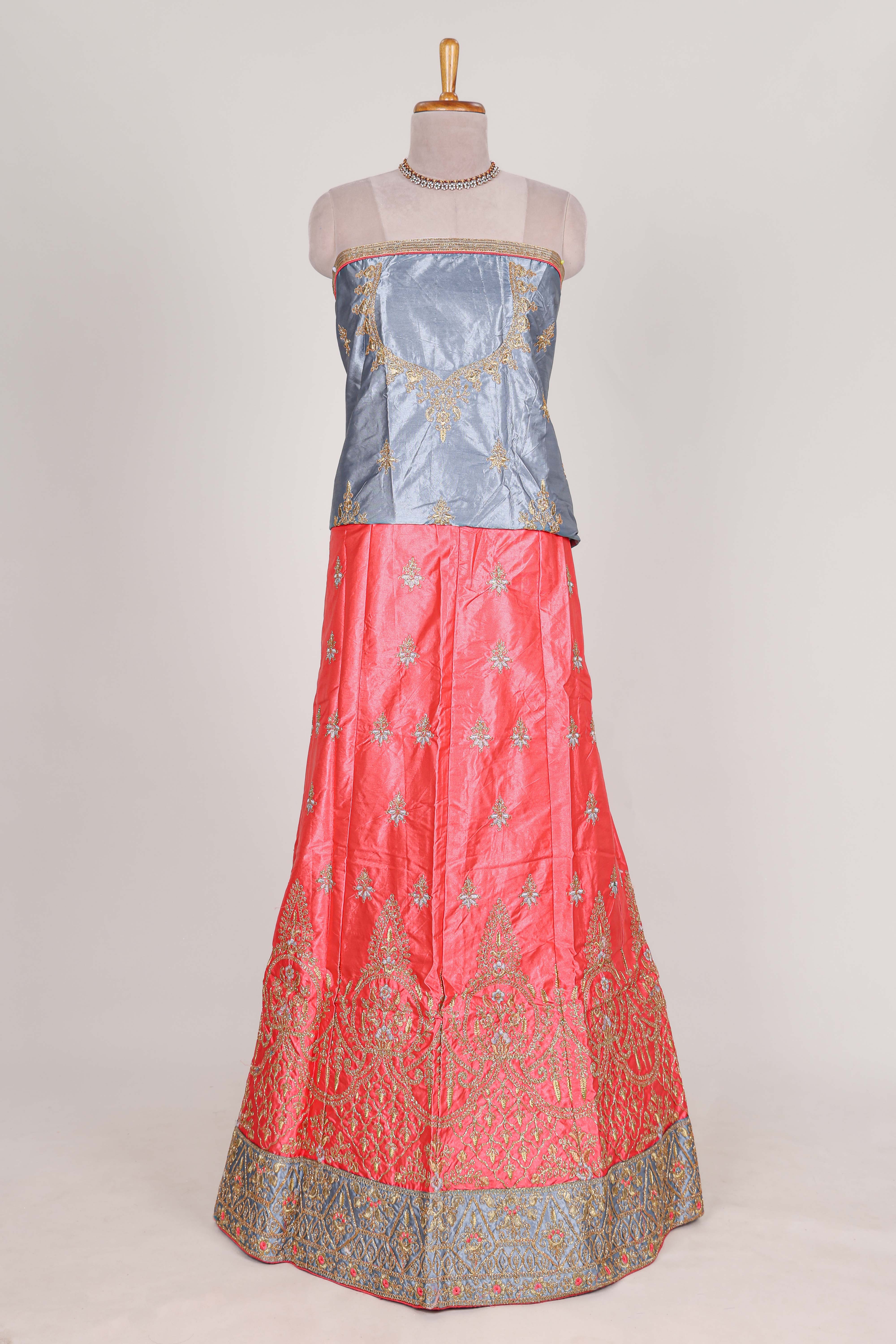Bright pink satin lehenga embroidery with a beautiful contrast border paired with a matching embroidered blouse