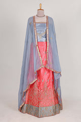 Bright pink satin lehenga embroidery with a beautiful contrast border paired with a matching embroidered blouse