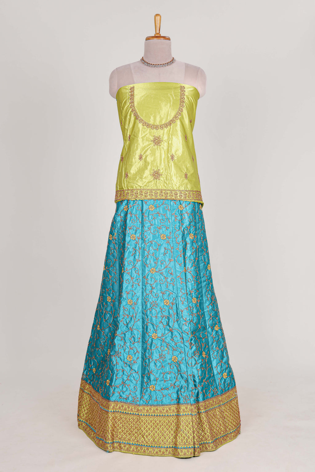 Blue and yellow satin lehenga embroidery with a beautiful contrast border paired with a matching embroidered blouse