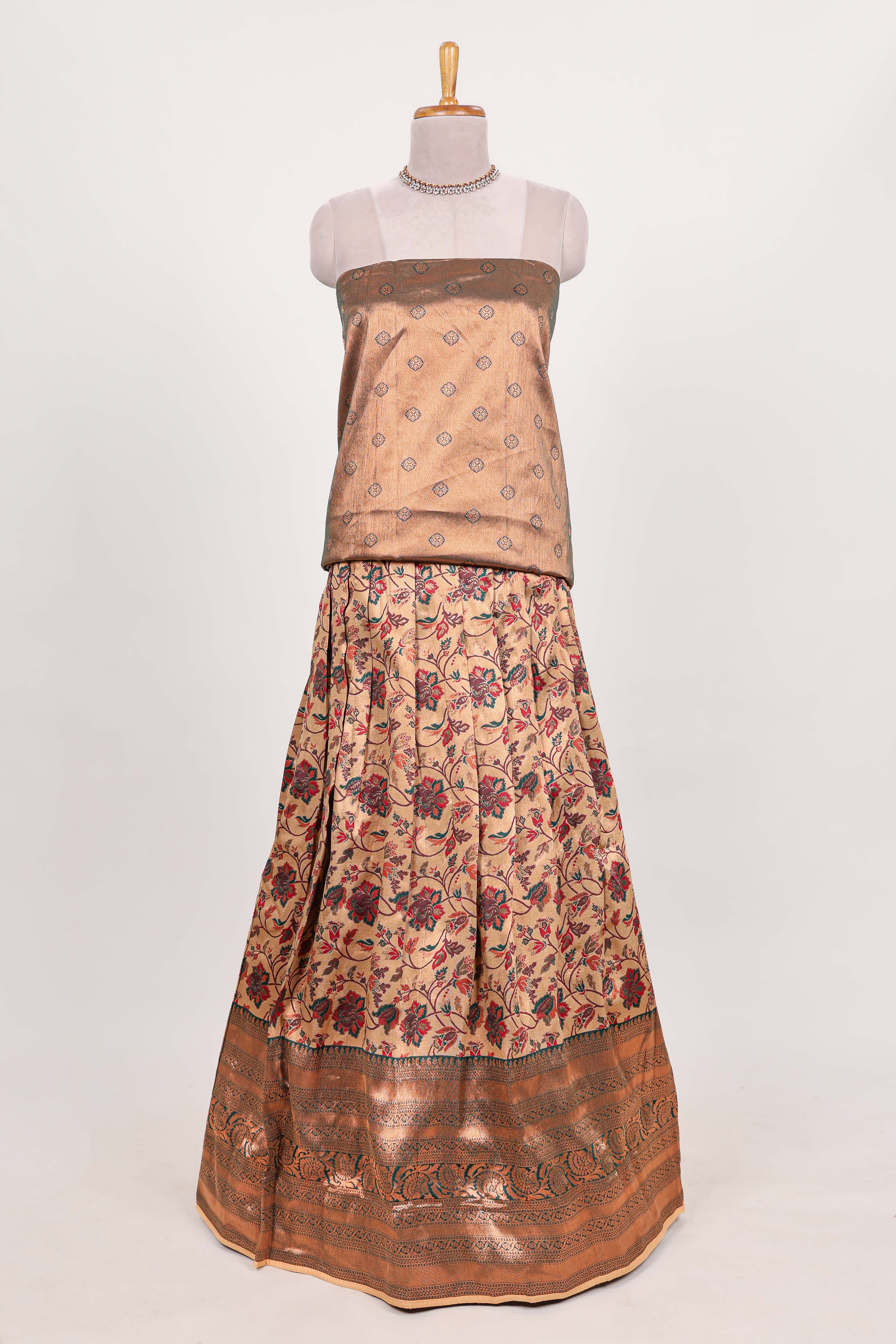 Green tissue lehenga featuring intricate thread weaving details with a beautiful contrast border Paired with a brocadeshawl