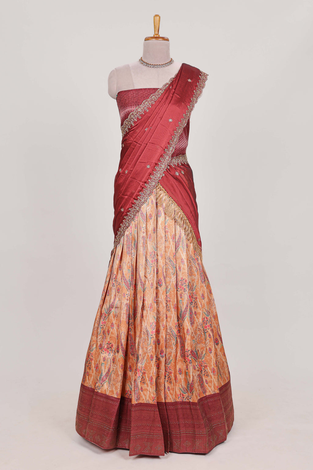Rani pink tissue lehenga featuring intricate thread weaving details with a beautiful contrast border Paired with a brocade  shawl