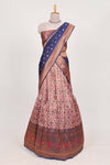 Navy bluetissue lehenga featuring intricate thread weaving details with a beautiful contrast border Paired with a brocadeshawl