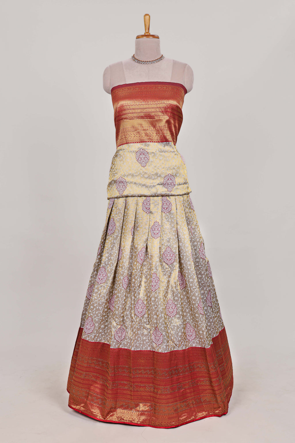 Red tissue lehenga featuring intricate thread weaving details with a beautiful contrast border Paired with a brocade  shawl