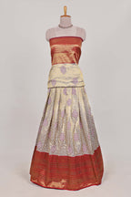 Red tissue lehenga featuring intricate thread weaving details with a beautiful contrast border Paired with a brocade  shawl