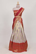 Red tissue lehenga featuring intricate thread weaving details with a beautiful contrast border Paired with a brocade  shawl