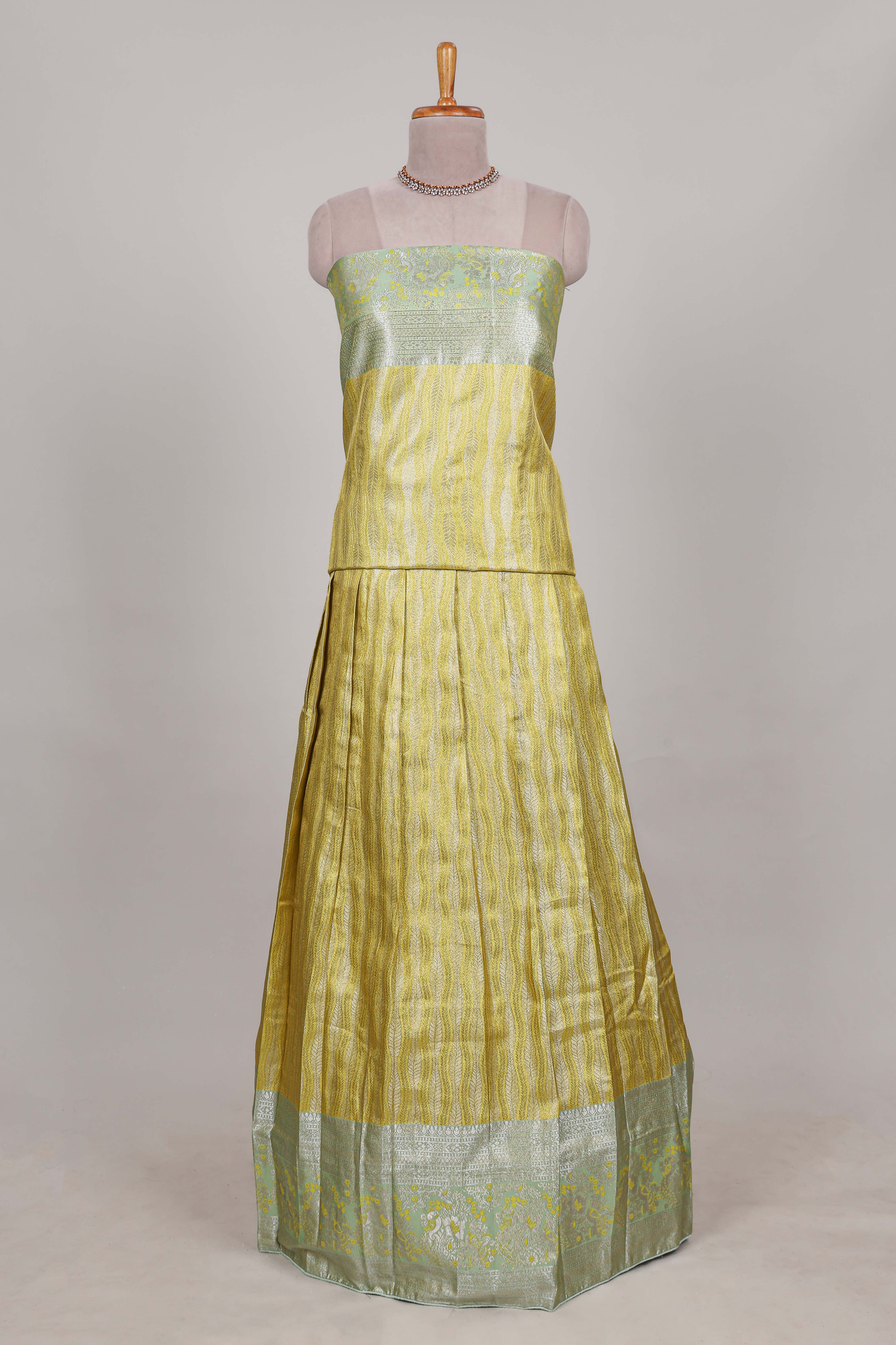 Lemon yellow tissue lehenga featuring elegant vertical line patterns with a beautiful contrast border Paired with a matching shawl