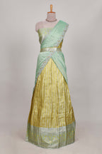 Lemon yellow tissue lehenga featuring elegant vertical line patterns with a beautiful contrast border Paired with a matching shawl
