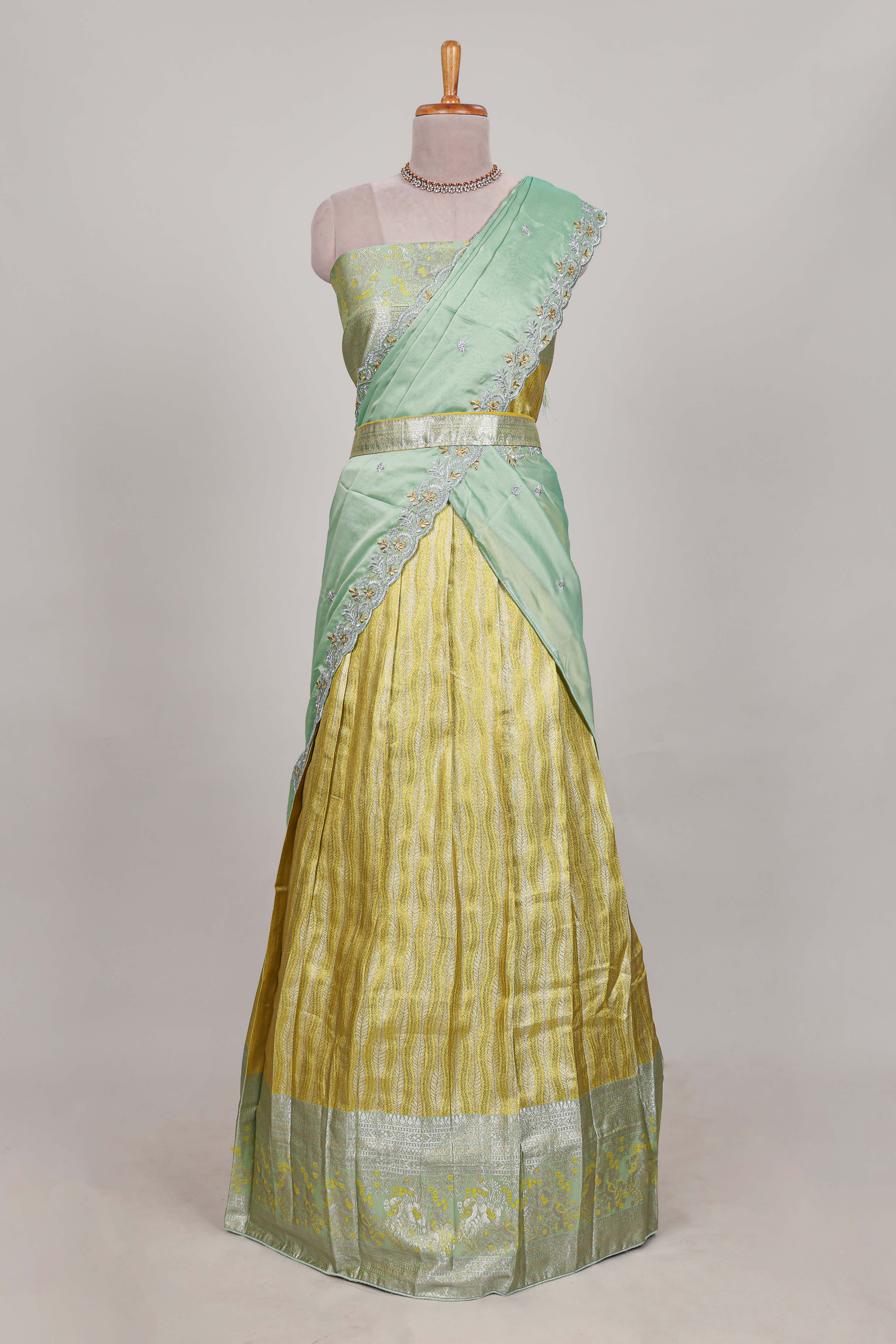 Lemon yellow tissue lehenga featuring elegant vertical line patterns with a beautiful contrast border Paired with a matching shawl