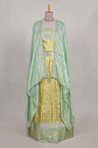 Lemon yellow tissue lehenga featuring elegant vertical line patterns with a beautiful contrast border Paired with a matching shawl