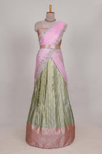 Pastel green tissue lehenga featuring elegant vertical line patterns with a beautiful contrast border Paired with a matching shawl