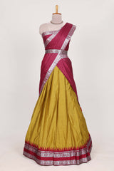 Mustard yellow silk cotton lehenga with a rich maroon shawl with a traditional silver zari woven border and contrast blouse