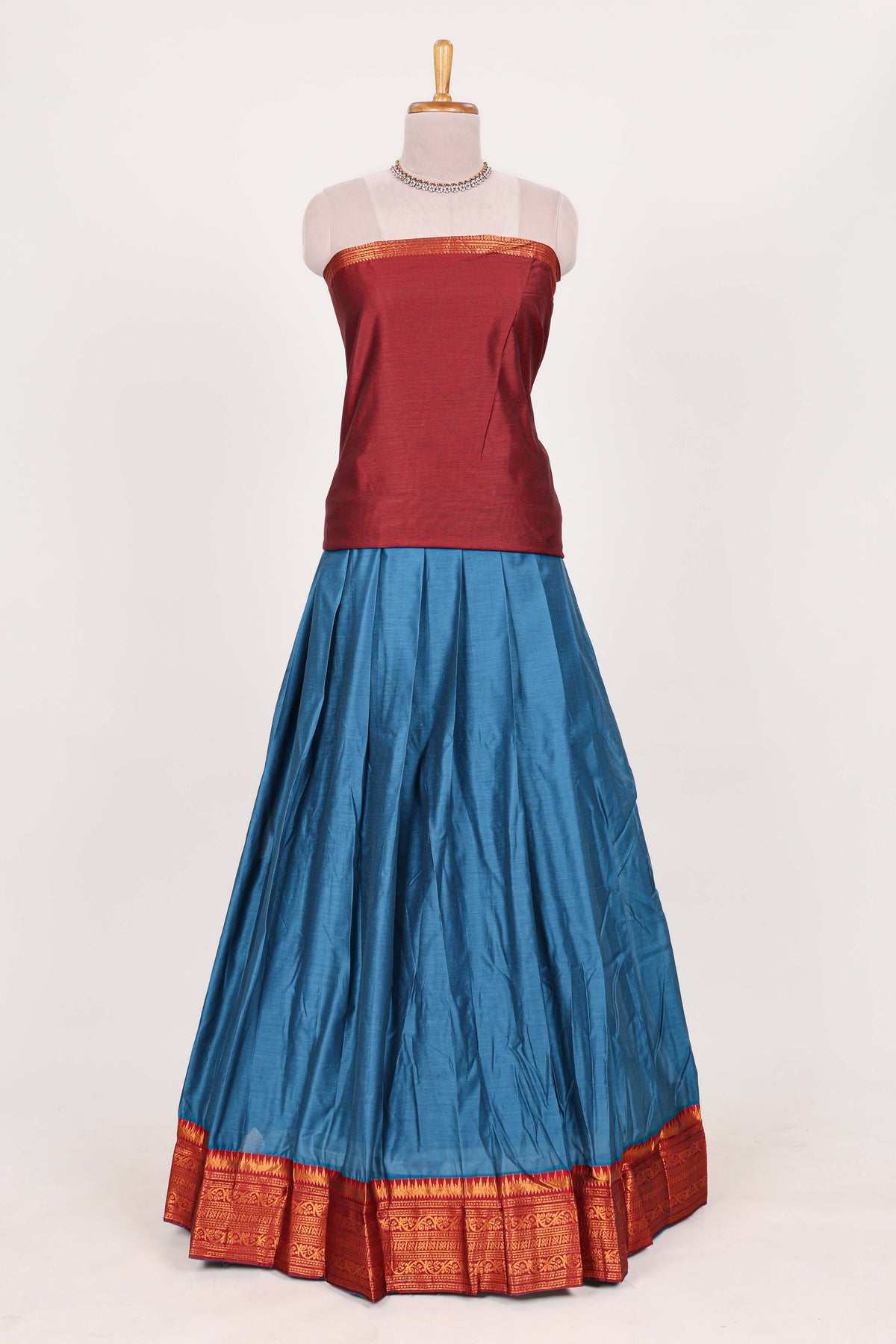 Royal blue  silk cotton lehenga with a rich maroon shawl with a traditional silver zari woven border and contrast blouse