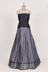 Grey silk cotton lehenga with a black shawl with a traditional silver zari woven border and contrast blouse