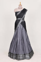 Grey silk cotton lehenga with a black shawl with a traditional silver zari woven border and contrast blouse