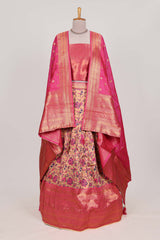 Pink colour eleganttissue lehenga featuring intricate thread weaving details with a beautiful contrast border Paired with a brocadeshawl