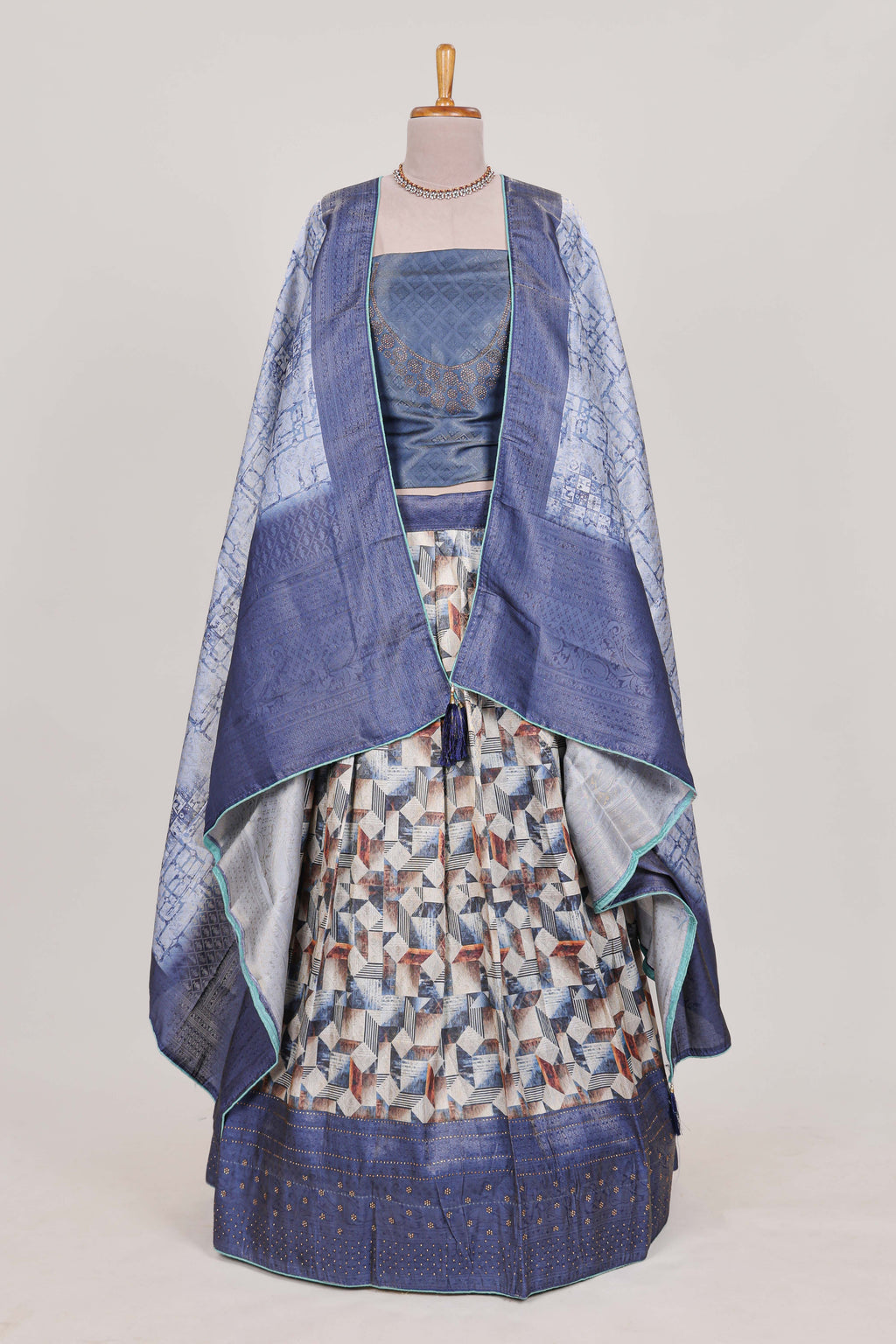 Ocean blue colour elegant  tissue lehenga featuring intricate thread weaving details with a beautiful contrast border Paired with a brocade  shawl