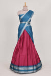 Rani pink silk cotton lehenga with a black shawl with a traditional silver zari woven border and contrast blouse