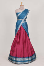 Rani pink silk cotton lehenga with a black shawl with a traditional silver zari woven border and contrast blouse