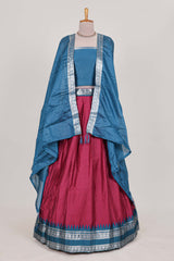 Rani pink silk cotton lehenga with a black shawl with a traditional silver zari woven border and contrast blouse