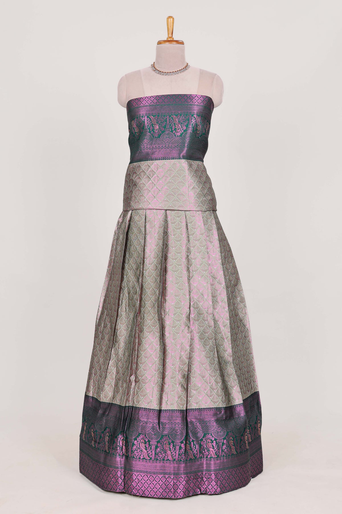 Silver tissue lehenga featuring intricate thread weaving details with a beautiful contrast border Paired with a brocade  shawl