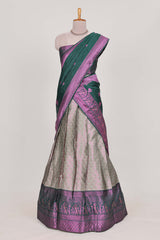 Silver tissue lehenga featuring intricate thread weaving details with a beautiful contrast border Paired with a brocadeshawl