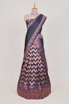 Navy bluelehenga featuring intricate copper thread weaving details with a beautiful contrast border Paired with a brocadeshawl