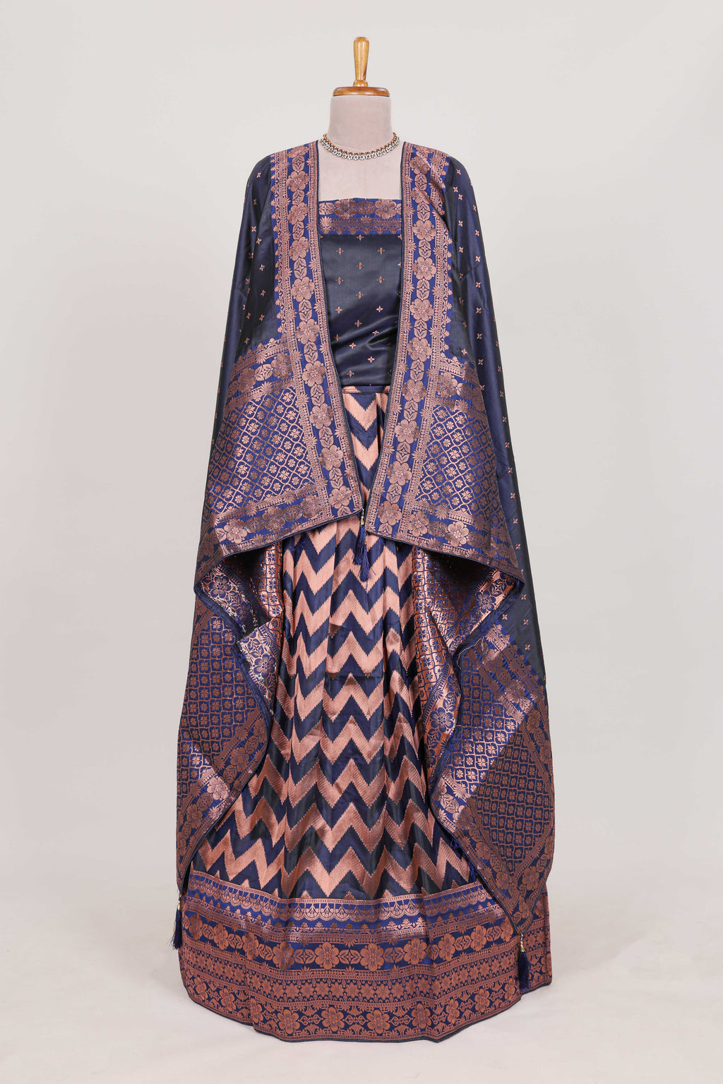 Navy blue  lehenga featuring intricate copper thread weaving details with a beautiful contrast border Paired with a brocade  shawl