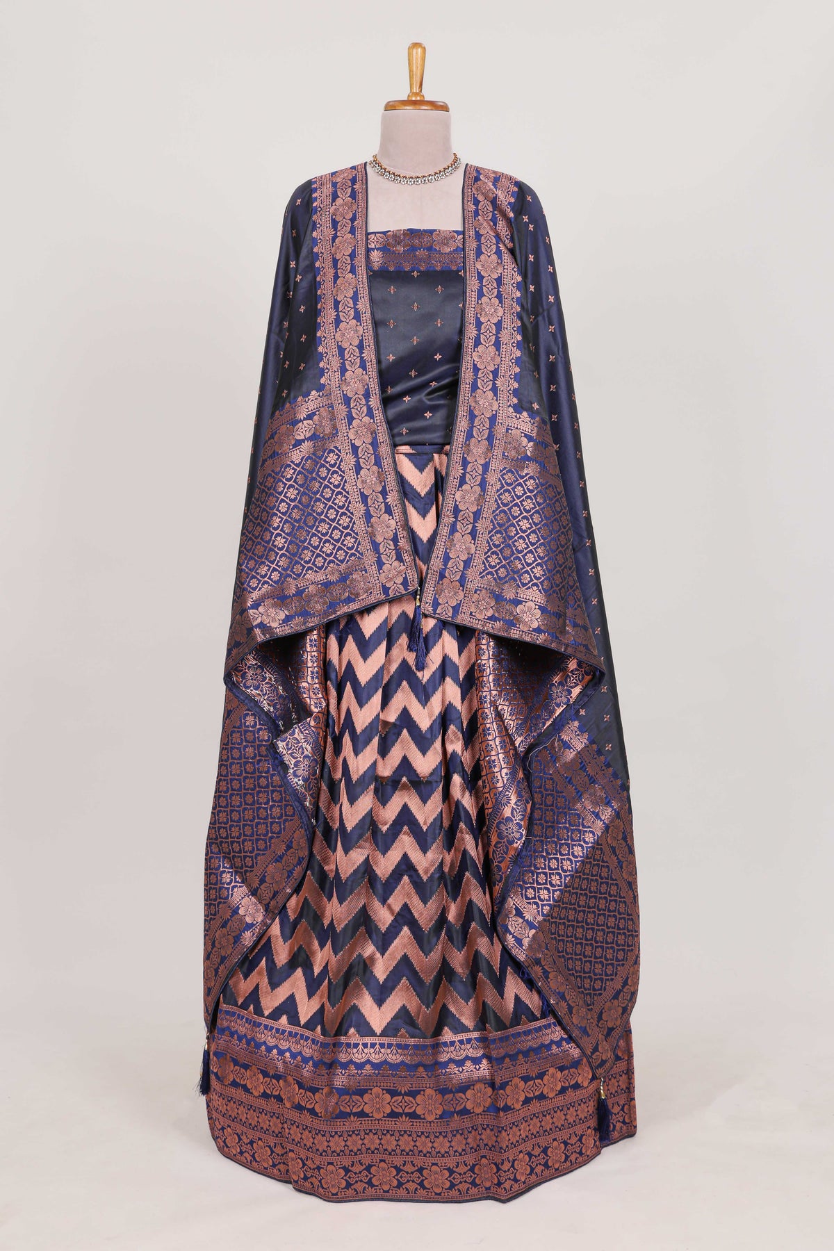 Navy blue  lehenga featuring intricate copper thread weaving details with a beautiful contrast border Paired with a brocade  shawl