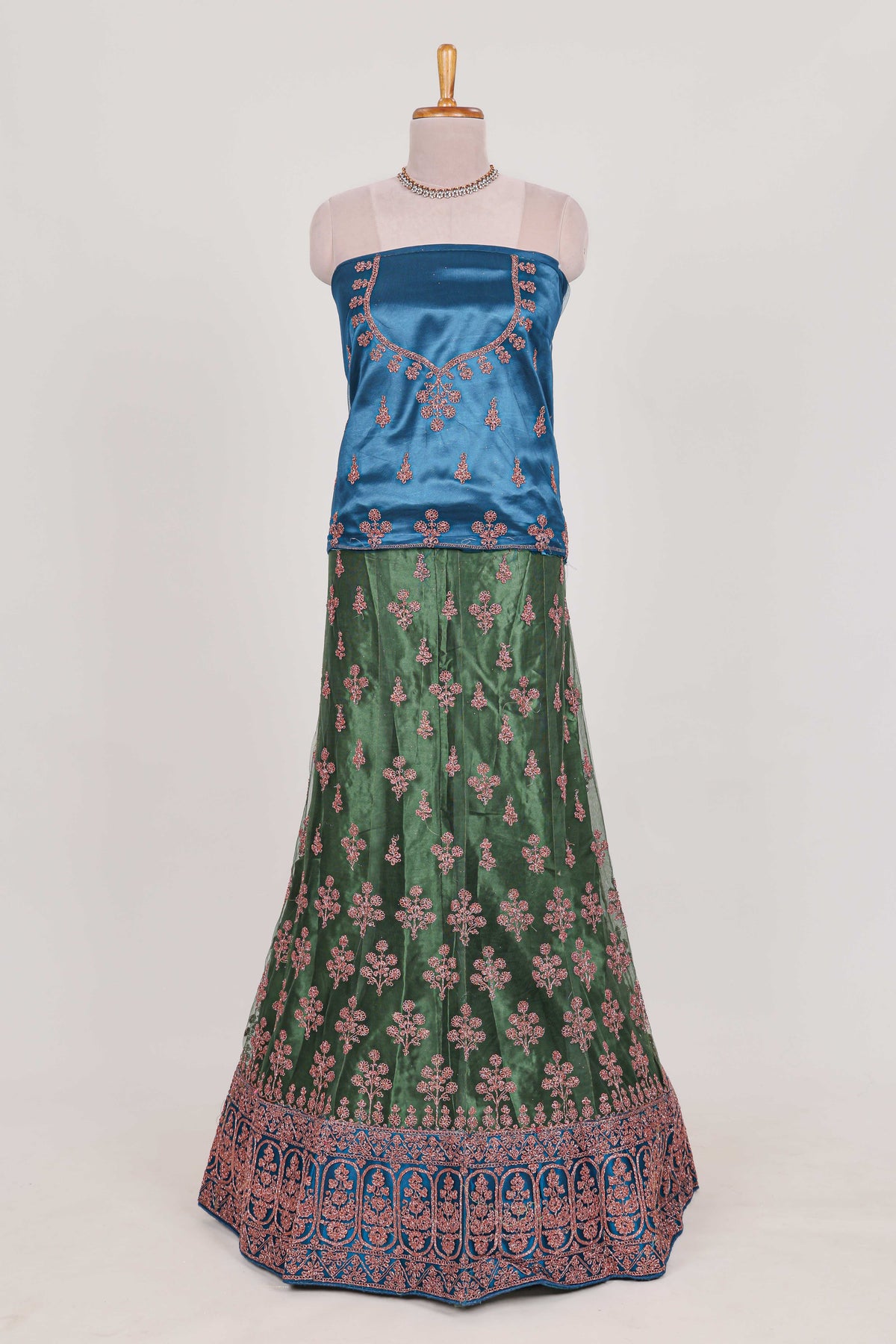 Green and blue Beautiful net lehenga with intricate embroidery stone work and contrast border paired with a contrast net shawl