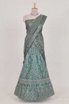 Pastel Sage Green Beautiful net lehenga with intricate embroidery stone work and contrast border paired with a contrast net shawl