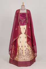 Sandle colour satin lehenga embroidery with a beautiful contrast border paired with a contrast embroidered shawl