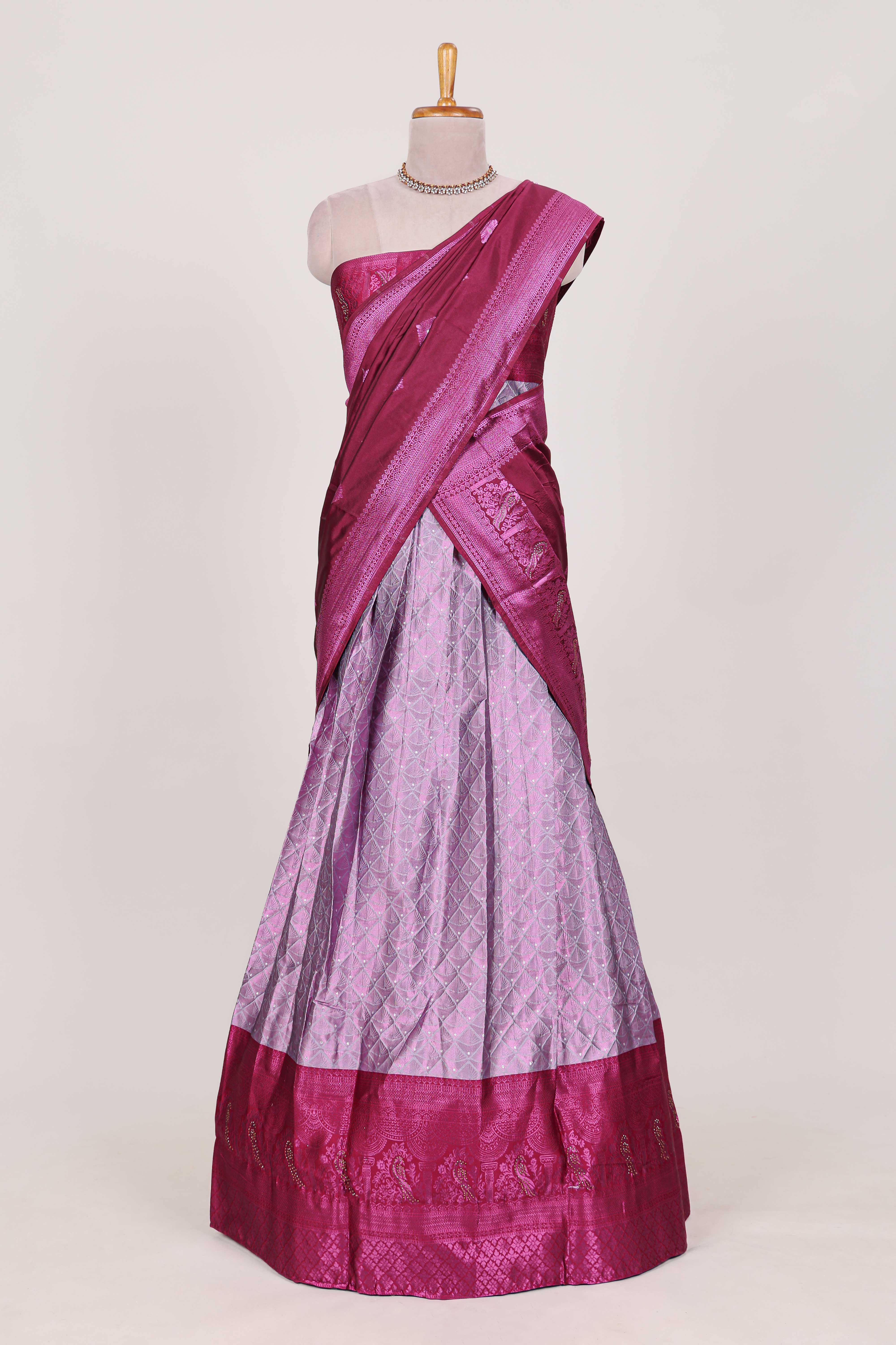 Lavender tissue lehenga featuring intricate thread weaving details with a beautiful contrast border Paired with a brocadeshawl