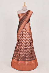 Brown lehenga featuring intricate copper thread weaving details with a beautiful contrast border Paired with a brocadeshawl