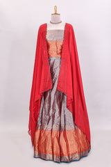 Lavender floral zari lehenga featuring contrasting bentex border Paired with plain red shawl with stone work