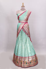 Pista green butta designed lehanga with contrast floral design border and contrast blouse paired with matching floral butta motifs shawl