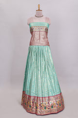 Pista green butta designed lehanga with contrast floral design border and contrast blouse paired with matching floral butta motifs shawl